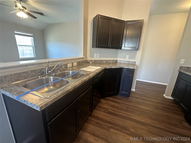 kitchen with sink, vaulted ceiling, dark hardwood / wood-style floors, ceiling fan, and kitchen peninsula