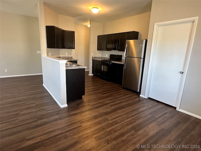 kitchen with black appliances, dark brown cabinets, dark hardwood / wood-style flooring, and light stone counters