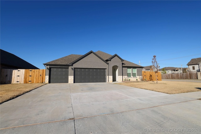 view of front of home with a garage