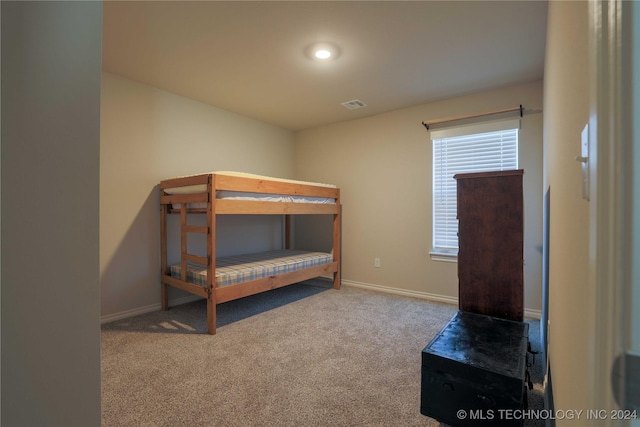 bedroom featuring carpet