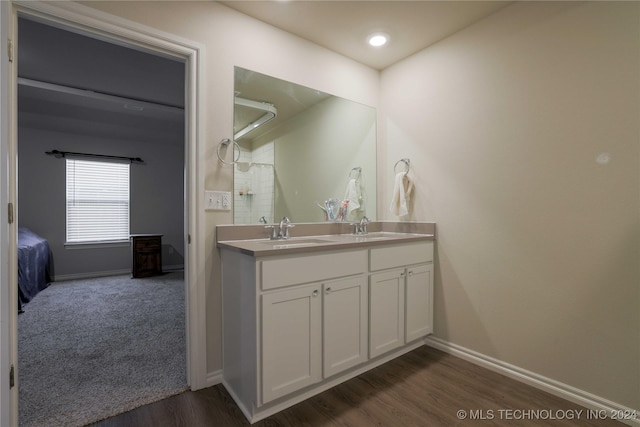 bathroom featuring hardwood / wood-style floors and vanity