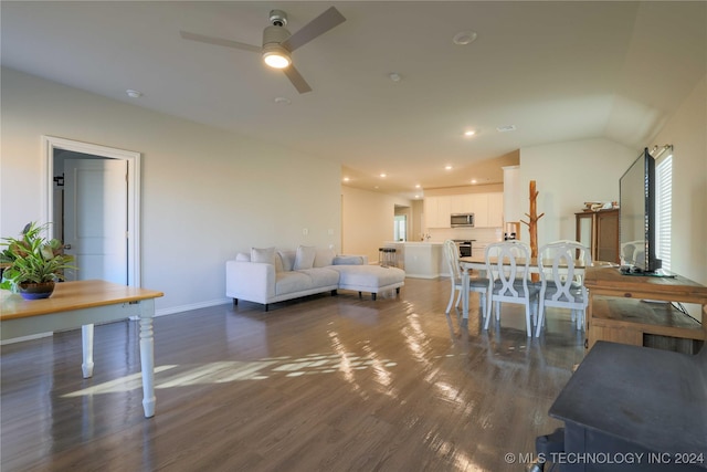 living room with dark hardwood / wood-style floors, ceiling fan, and lofted ceiling