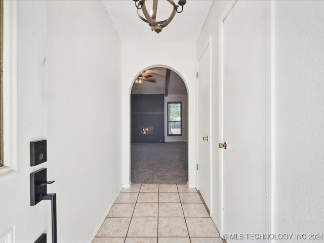 corridor featuring light tile patterned floors