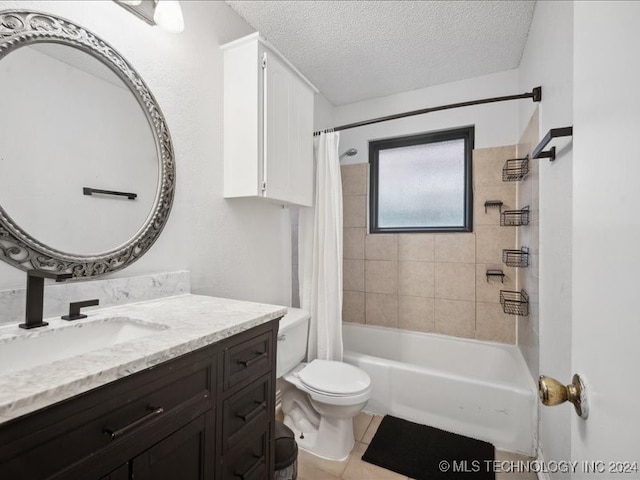 full bathroom featuring tile patterned floors, a textured ceiling, toilet, shower / tub combo with curtain, and vanity