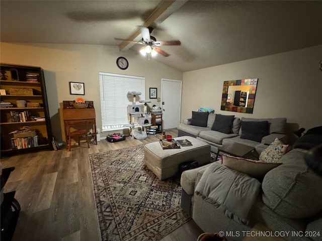 living room featuring hardwood / wood-style floors, lofted ceiling with beams, and ceiling fan