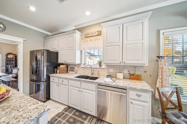 kitchen with white cabinetry, sink, stainless steel appliances, backsplash, and crown molding