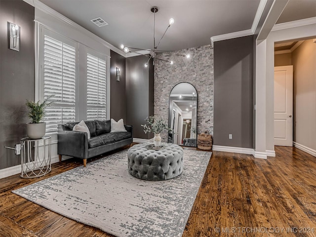 10673 S 93rd E Ave, Tulsa, OK 74133 - living room with wood finished floors, baseboards, arched walkways, ornamental molding, and a chandelier