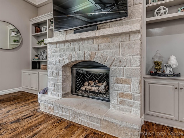 10673 S 93rd E Ave, Tulsa, OK 74133 - detailed view of wood finished floors, a stone fireplace, and baseboards