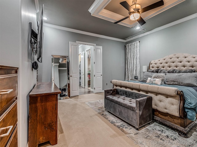 carpeted bedroom featuring a raised ceiling, ceiling fan, and crown molding