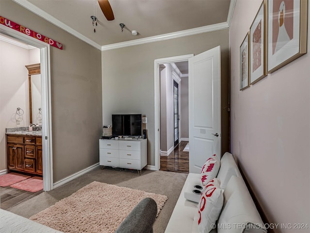 bedroom with ceiling fan, ensuite bathroom, and crown molding