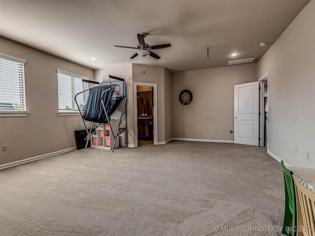 interior space featuring carpet and ceiling fan