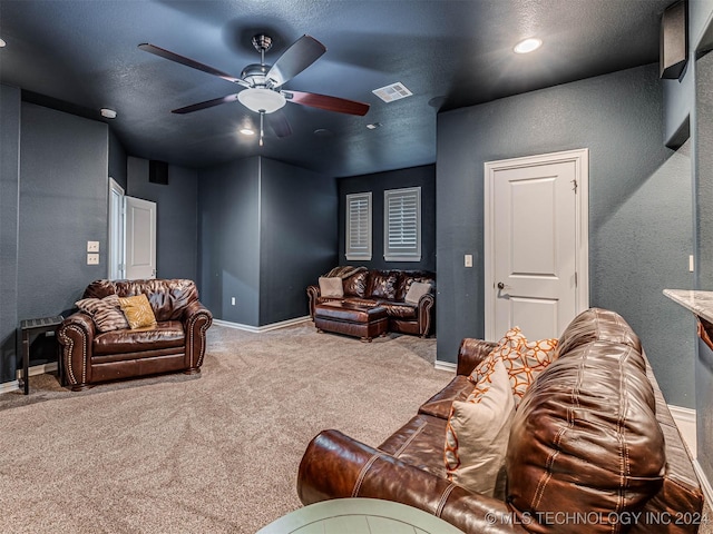 carpeted living room featuring ceiling fan