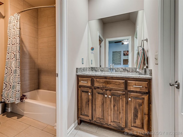 bathroom with tile patterned floors, shower / bath combo, ceiling fan, and vanity