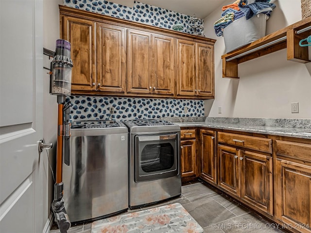 laundry area with cabinets and separate washer and dryer