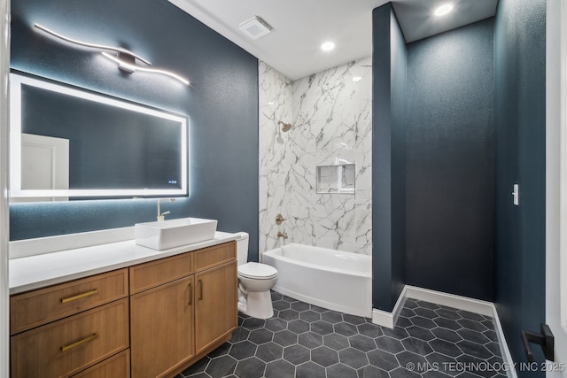 bathroom featuring visible vents, toilet, washtub / shower combination, vanity, and tile patterned flooring