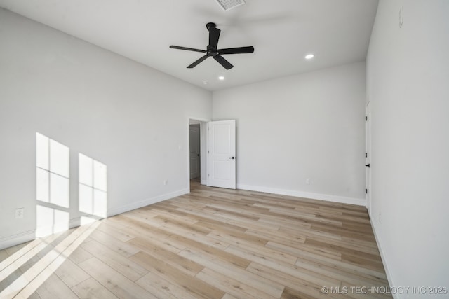 empty room featuring recessed lighting, visible vents, ceiling fan, wood finished floors, and baseboards