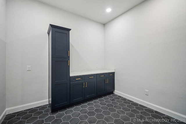 bar featuring recessed lighting and baseboards