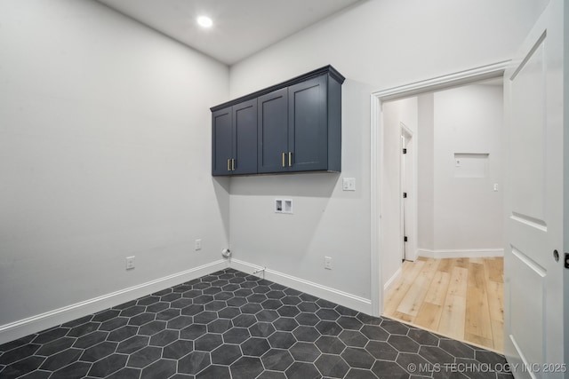 laundry room featuring hookup for a washing machine, recessed lighting, cabinet space, and baseboards