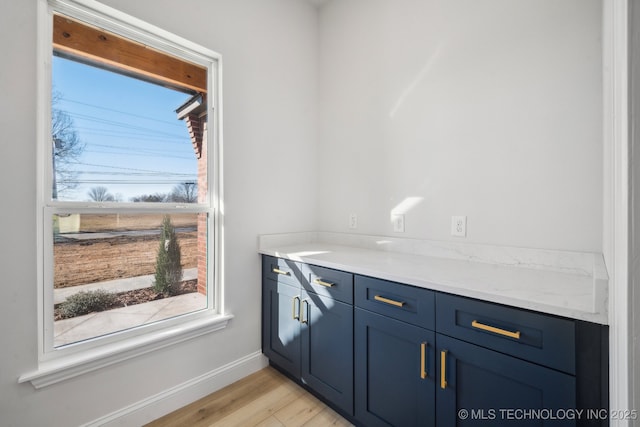 interior space with light wood-style flooring and baseboards