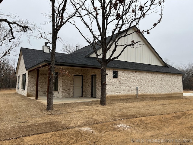 view of side of property featuring a patio