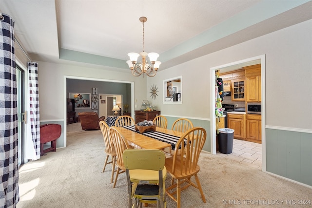 carpeted dining area with wood walls and a chandelier