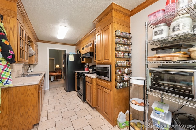 kitchen with black electric range, ornamental molding, a textured ceiling, and sink