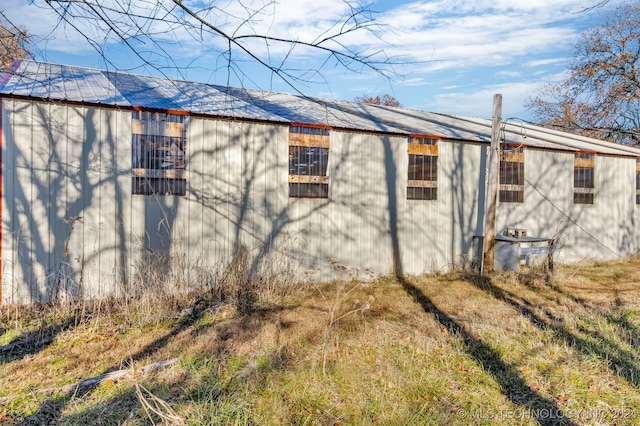 view of side of home with central air condition unit