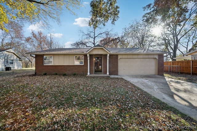 ranch-style home with a garage