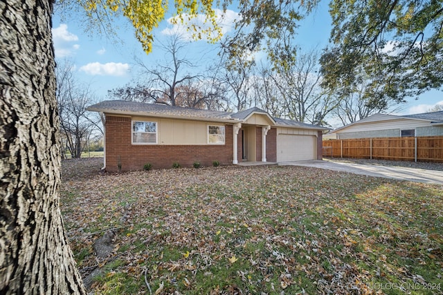 ranch-style home featuring a garage