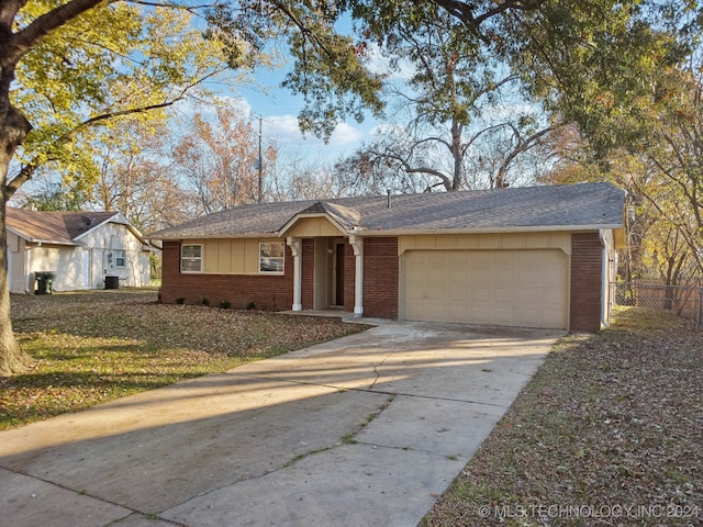 single story home featuring a garage