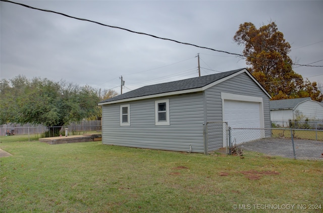 garage featuring a yard