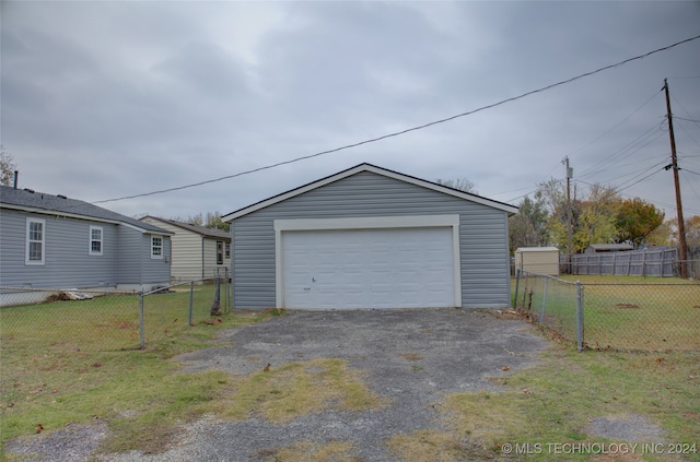 garage with a lawn