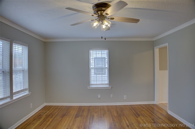 unfurnished room with ceiling fan, hardwood / wood-style floors, and ornamental molding