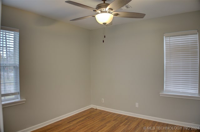 empty room featuring ceiling fan and hardwood / wood-style flooring