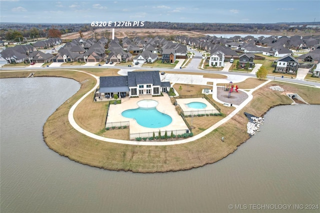 birds eye view of property featuring a water view