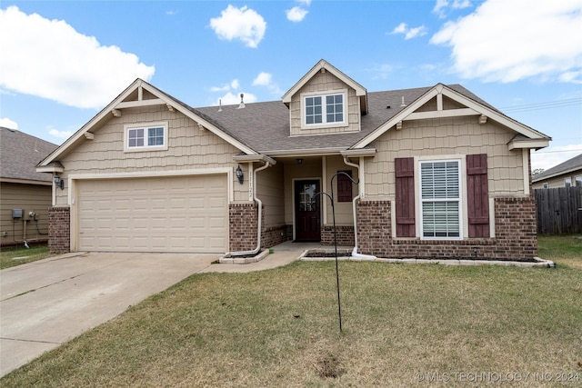 craftsman-style home featuring a garage and a front lawn