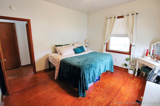 bedroom featuring dark hardwood / wood-style flooring