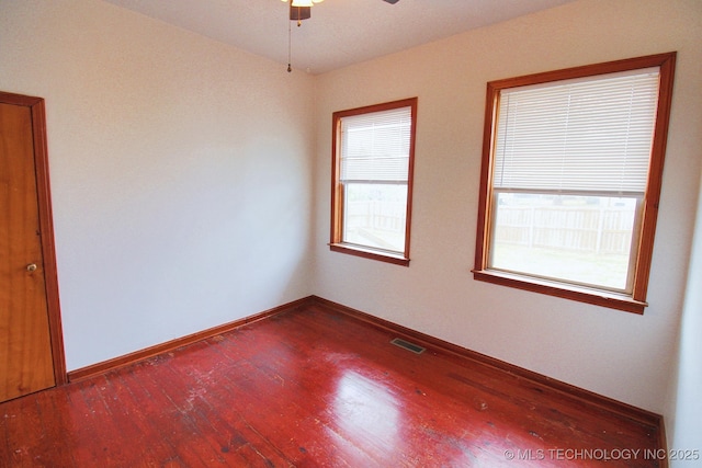 spare room featuring ceiling fan and hardwood / wood-style floors