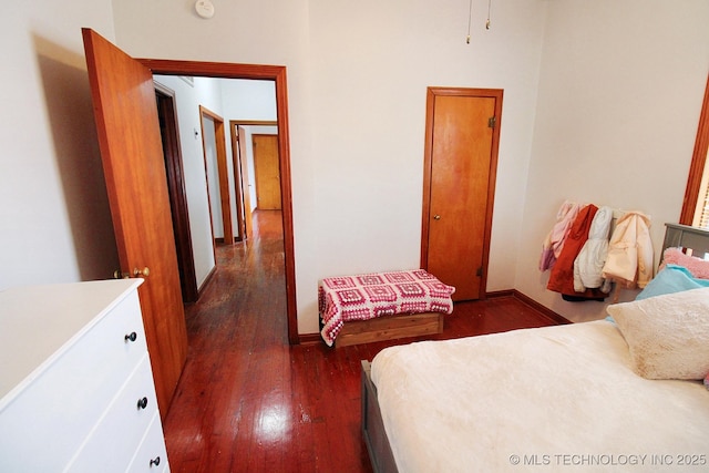 bedroom featuring dark wood-type flooring