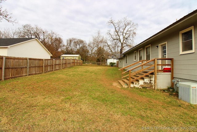 view of yard featuring central AC unit