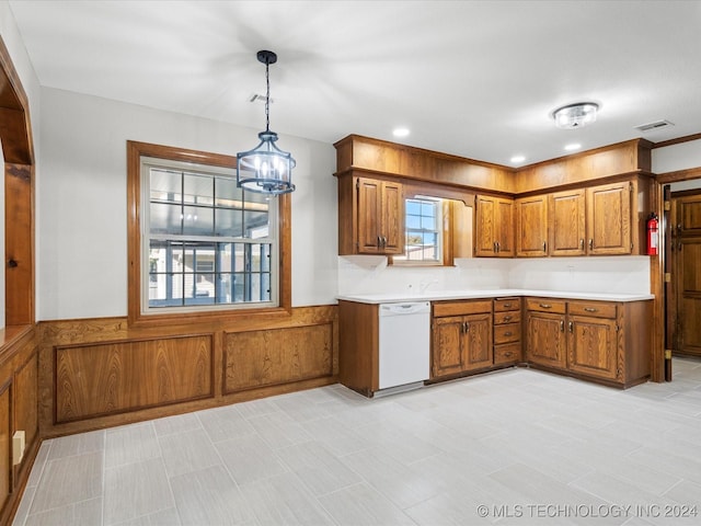 kitchen with white dishwasher, hanging light fixtures, and a chandelier