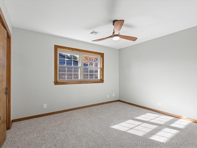 carpeted empty room with ceiling fan