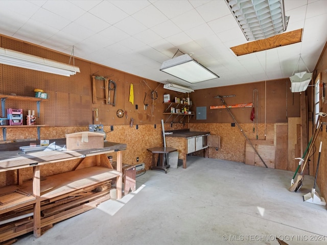 miscellaneous room with a workshop area and electric panel