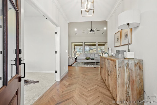 hallway with light parquet flooring and ornamental molding