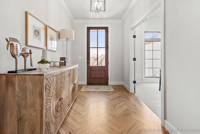 foyer featuring crown molding, light parquet flooring, and a notable chandelier