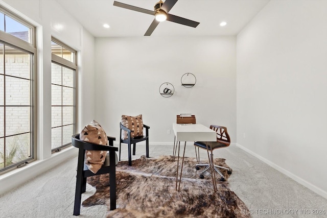 home office with ceiling fan and carpet flooring