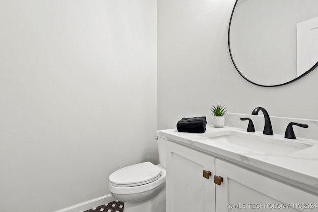 bathroom with vanity and toilet