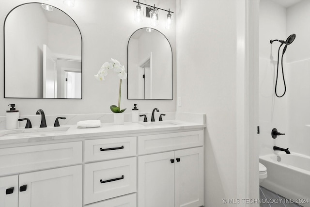 full bathroom with vanity, bathtub / shower combination, and toilet