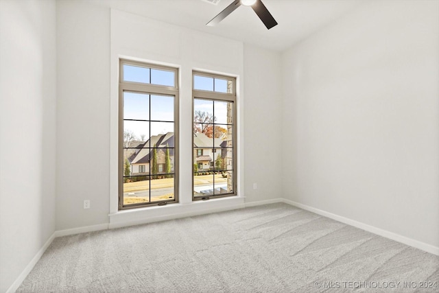 empty room with carpet and ceiling fan