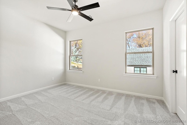 carpeted empty room with ceiling fan